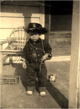photo of a young boy dressed up as a cowboy