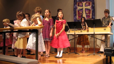 The children sing their final choral number