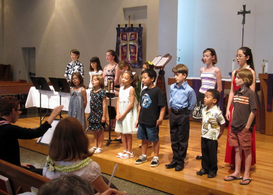 The F.R.O.G.S. Choir and Chamber Orchestra sing at the beginning of the program