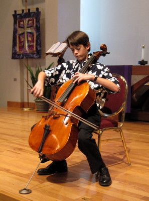 A young cellist performing