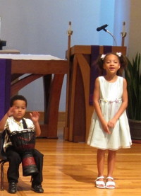 Brother and sister perform with drum and voice