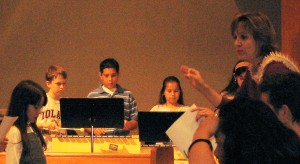 Older children playing Orff instruments to accompany the Jesse Tree chorus. Older children playing Orff instruments to accompany the Jesse Tree chorus.