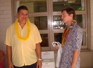 Ray Herradura (left) gives Intern Josh Graber a handmade lei.