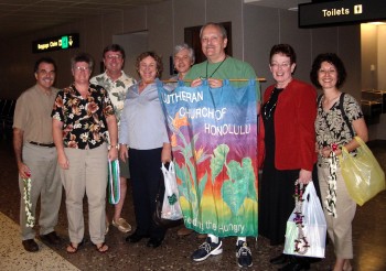 LCH members welcome the Lilley family at the airport