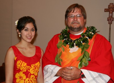 A young hula dancer greets Pastor Jeff. She danced a hula as part of the prelude.