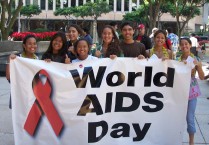 Young people holding World AIDS Day banner