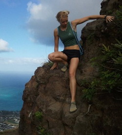 Sarah Roseberg climbing rocks.