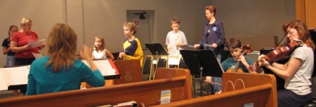 The F.R.O.G.S. Ensemble prepares for the Jesse Tree finale on December 24