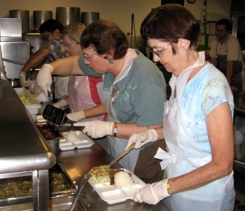 LCH members serving up dinner at IHS