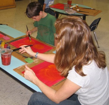 Mother and son enjoy painting together