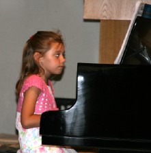 A child playing the piano A child playing the piano
