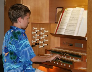 A young organist played David Schack’s “Prelude.”