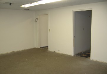 The Boardroom after the ceiling and walls had been painted and the carpet had been removed.