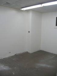 The Counting Room after the ceiling and walls had been painted and the carpet had been removed.