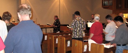 The congregation singing the Navy hymn