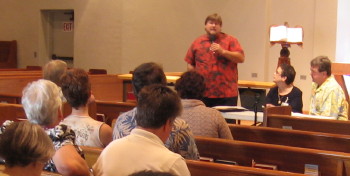 Pastor Jeff Lilley addressing the congregational meeting