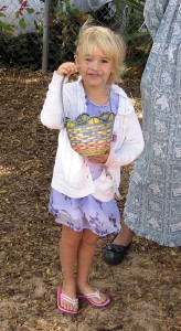 One of the little children showing off her basket of Easter eggs.