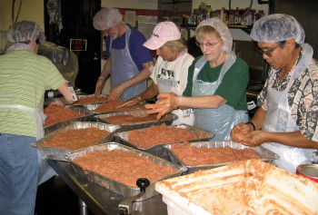 The LCH crew mixes meatloaf to be served to the clients at IHS