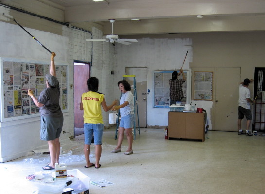 Members of the crew put on the primer coat in Isenberg Hall.