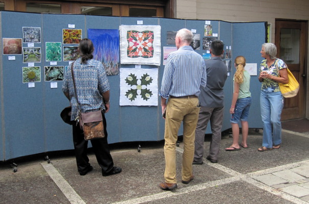 Members view some of the artistic creations on display
