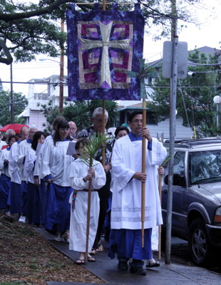 Jerome leads the Palm Sunday procession around the church