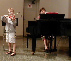 A young violinist plays the offertory.