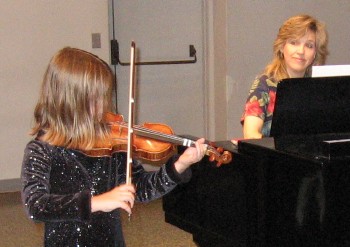 A girl plays J.S. Bach’s “Minuet II.”