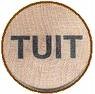 Picture of a round “tuit”