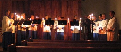 The Compline Choir singing by candle light