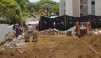 the crew goes to work leveling the lot.