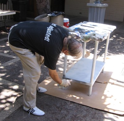 Roy Helms spray painting one of the counters Roy Helms spray painting one of the counters