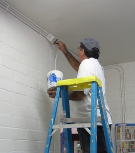 Randy Castello touching up the walls