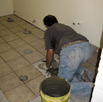 Tile going down in the women’s rest room. Tile going down in the women’s rest room.