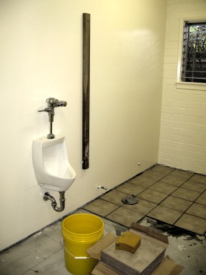 Men’s rest room with urinals installed.