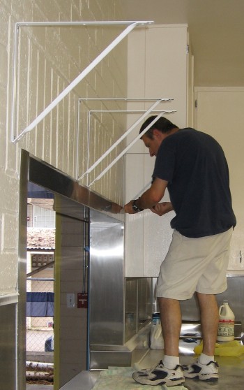 Jim Sullivan putting up shelves Jim Sullivan putting up shelves