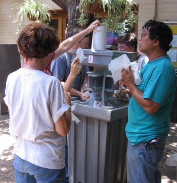 Workers using the washing station in the courtyard