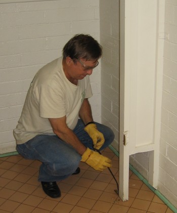 Fred Benco removes hardware so the partitions can be taken out
