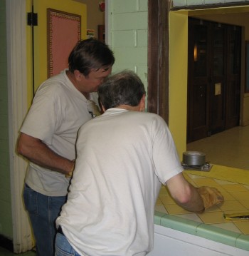 Fred Benco and Bill Fay do prep work in the kitchen