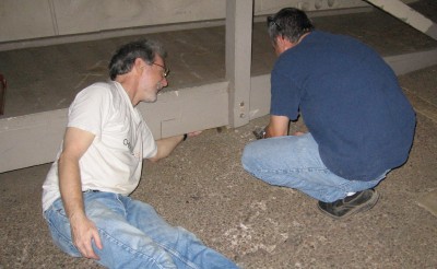 Bill Fay and Jim Sullivan remove bolts so the ramp railings can be taken off.