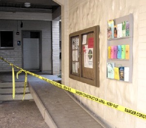 Caution tape keeping people away from the ramp and rest rooms