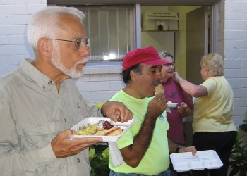 Steven Miller, Randy Castello, and Linda Miller enjoy breakfast while Judie Boutá from the food crew goes to the Board Room to get more food