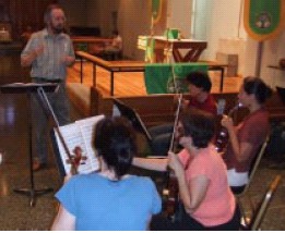 Carl Crosier conducts a rehearsal for Mozart Vespers