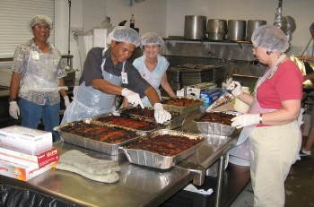 LCHers busy at work getting ready to feed the homeless at the Institute for Human Services (IHS). Meatloaf every third Friday! What a treat.