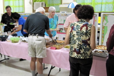 Everyone loaded their plates with the delicious Italian dishes on the serving line.
