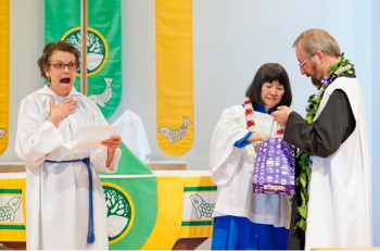 Mary Fastenau reads the letter with Carl and Kathy's generous gift