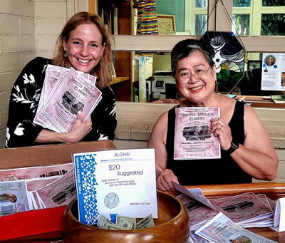 Spreading cheer and concert programs—thank you, Marie and Cathy, for the warm welcome