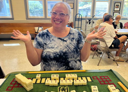 Linda Miller plays a thrilling game of mahjong at Game Day!