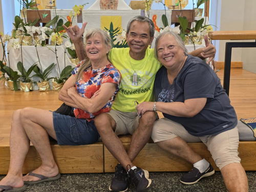 Paula, Rudy, and Linda celebrate after decorating the altar for Easter.