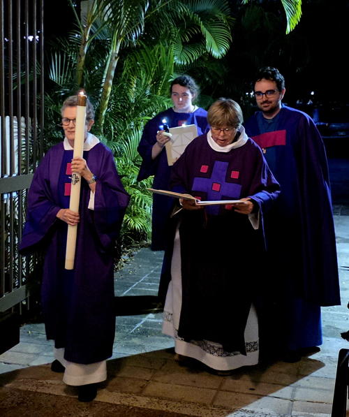 The Easter Vigil procession enters the courtyard.
