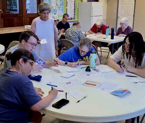 VIA hard at work making postcards to encourage voter turnout.